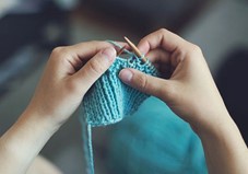 photo of hands knitting