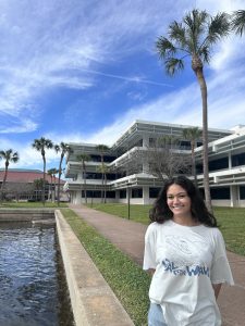 USF student Kierstyn Benjamin in front of the library at USF St Pete