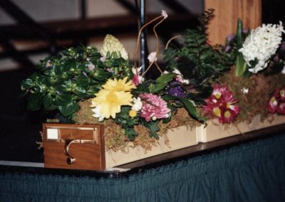 Card Catalog Drawer filled with flowers as a memorial.